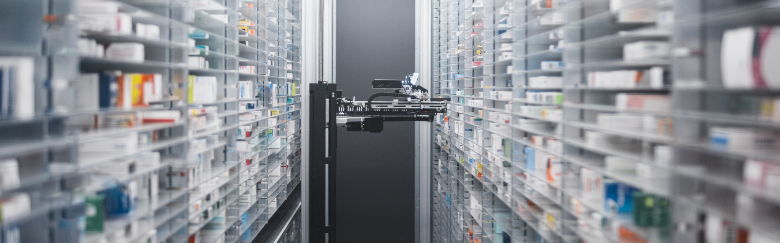 AI in specialty pharmacy robotic AI device selecting medications from the shelf.